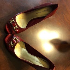 Red Leather Heel with Gold Chain on top.